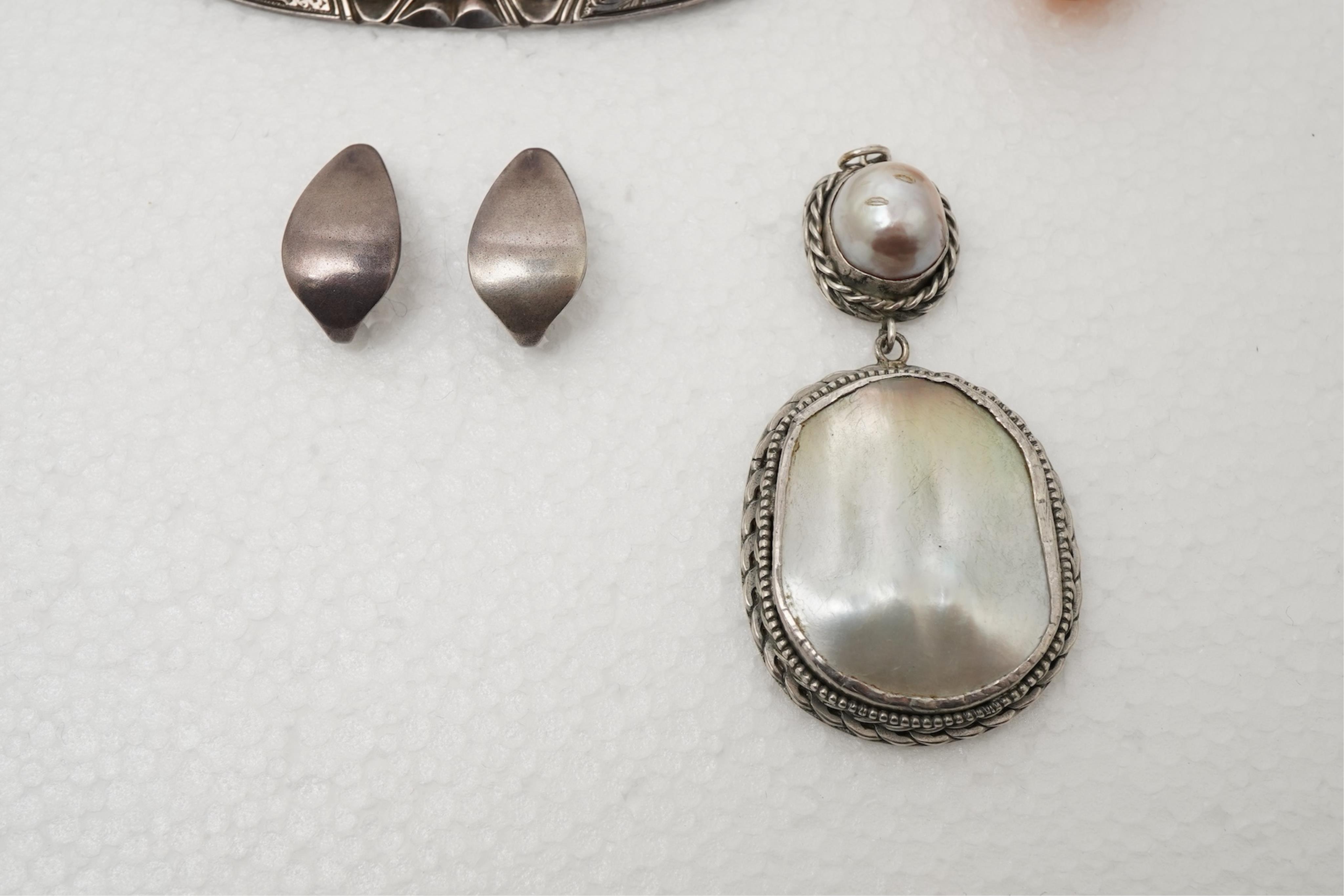 A collection of Arts & Crafts jewels including a pair of silver earrings by Georg Jensen